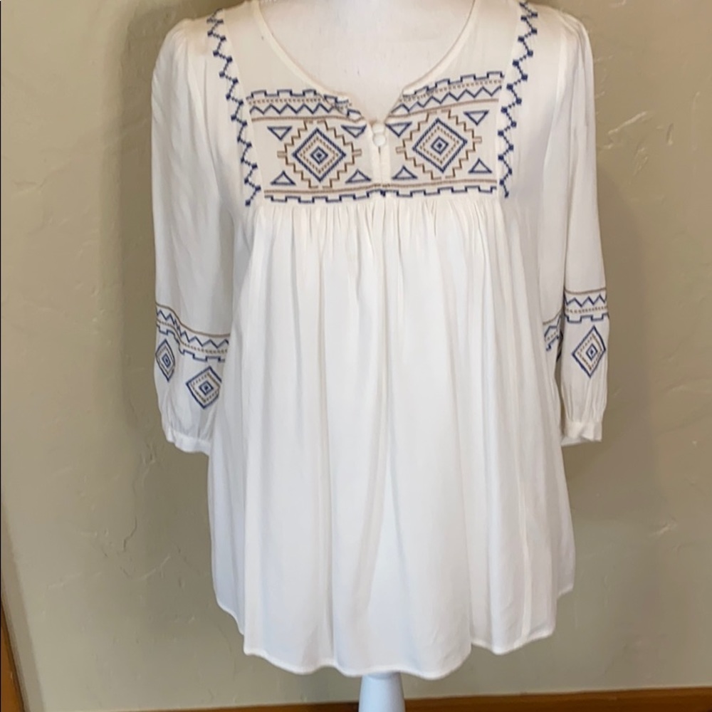 White with blue embroidered tunic